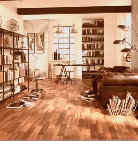 Industrial Living Room - Living RoomLarge Industrial Loft-style Laminate Flooring And A Brown Floor Are