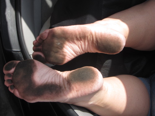 Beautiful pitch black female dirty soles 