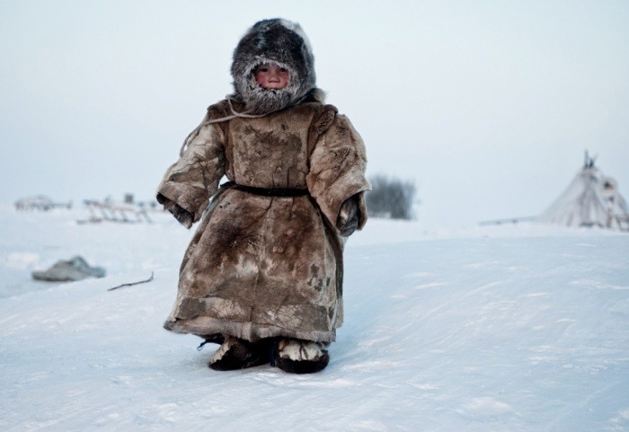 mazzystardust:  A Young Nenets boy plays in -40C temperatures in Siberia ph. Simon