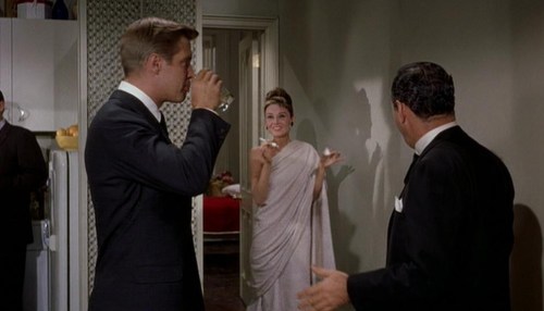 gatabella:  Audrey Hepburn, Breakfast At Tiffany’s, 1961It’s a bed sheet you see her wearing at her cocktail party. A scene was cut from the film in which Holly is taking a bath and has to improvise a gown on the spot. One more example that Audrey