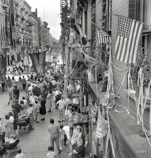 August 1942. New York. “Dancing and music on Mott Street at a flag raising ceremony in honor o