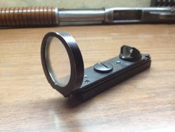 unsubstantiatedrumors:  1947 Nydar Shotgun sight. Uses no electronics but reflects ambient light to project the sight picture.  Retro-tacticool. 