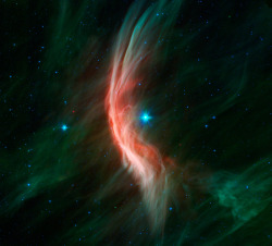 Zeta Ophiuchi, a runaway star: It is moving toward the left at 24 km PER SECOND. A strong stellar wind precedes it, compressing and heating dusty interstellar material and shaping the bow shock. Its velocity comes from being ejected from a binary star