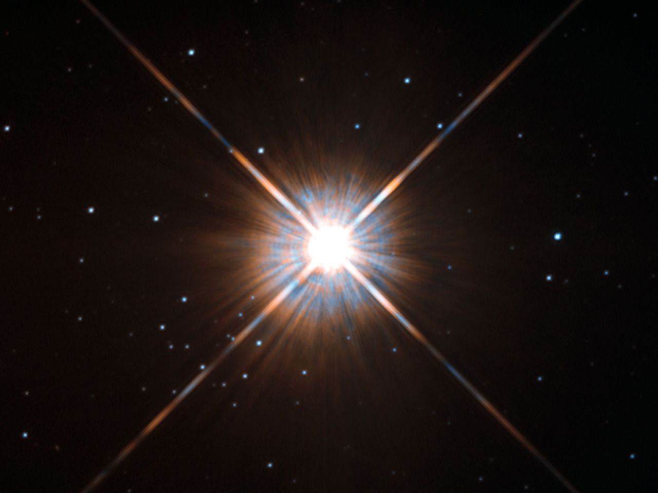 Why do stars have four “arm-twinkles” that look like a cross coming out of the