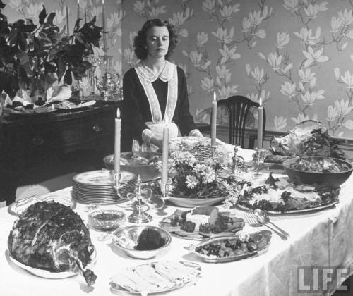 Maid setting up a buffet (Nina Leen. 1945)