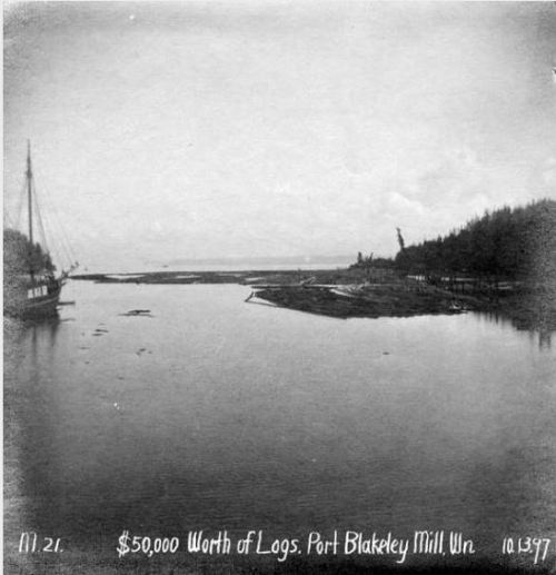 Port Blakely Lumber Mill showing floating logs, 1897