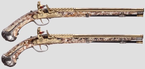 Magnificent pair of ornate ivory stocked flintlock pistols by Christoph Tressler of Landau,Germany. 