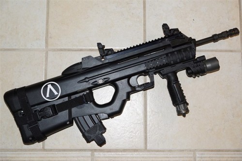 gunrunnerhell:  FN FS2000 The civilian model of the F2000, this 5.56x45/.223 bullpup consists of a largely polymer shell. Early models had an factory scope with housing that matched the overall aesthetics of the rifle. Current models ditch the scope and