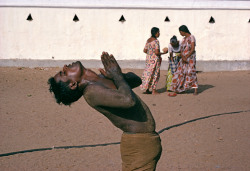 indoafrican:Bruno Barbey.  SRI LANKA. 1979. Man praying during July festival dedicated to Kataragama the Hindu god of War and Violence.  