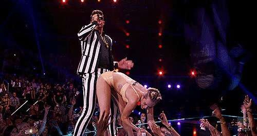 lady-j1997:  its-we-who-own-the-night:  Past Miley to present day Miley.  I will never be able to look at foam fingers the same ever again
