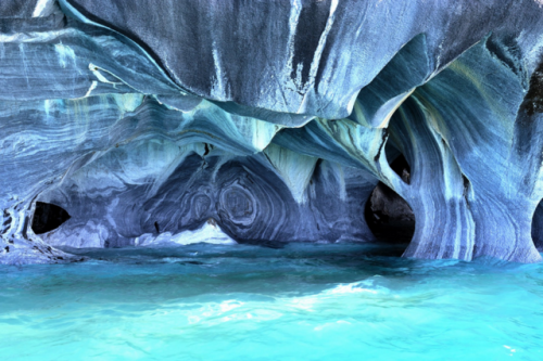 sixpenceee:It took 6,000 years of churning of water to carve Argentina’s Marble Caves.