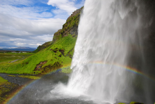 Waterfalls and rainbows in Iceland just a little bit west of Skógar falls.  It is not the biggest wa
