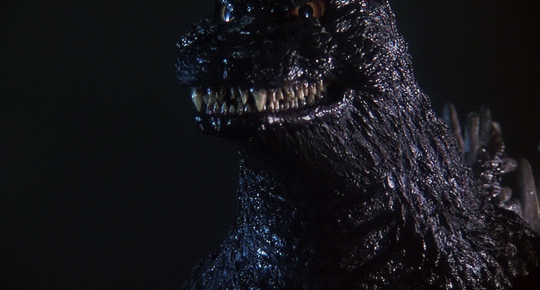 A GIF of Godzilla roaring.