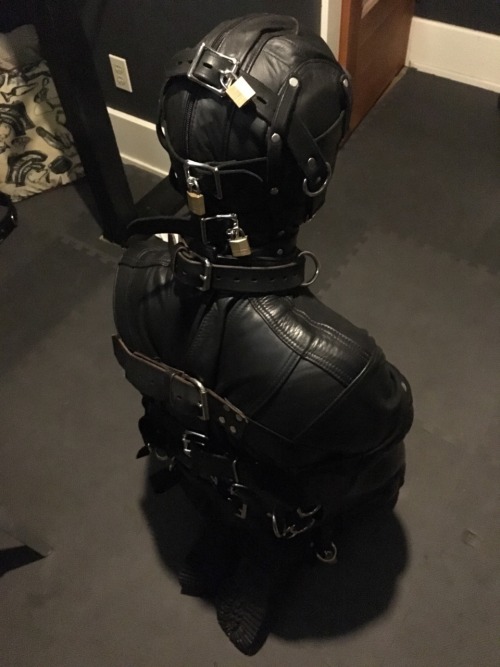 seabondagesadist:  Straitjacket and cell storage. The boy wanted to make me happy. Nothing makes me happier than a boy in heavy bondage, leathered and chained up in the cell for awhile… 😈😈😈 