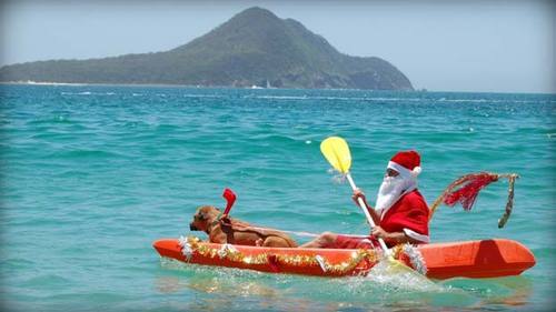 thebeautyofmoonlight:  relahvant:  everyone’s making their blogs all snowy and stuff for christmas while here in australia christmas is literally this   it was 36 degrees today and i saw an ad on tv with about 20 santas surfing and waving a christmas