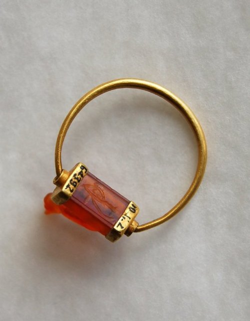 Gold Finger Ring with Cat Bezel Ancient Egyptian gold ring with carnelian bezel carved into a c