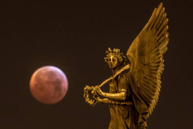 Angels summoning the wolf blood moon.