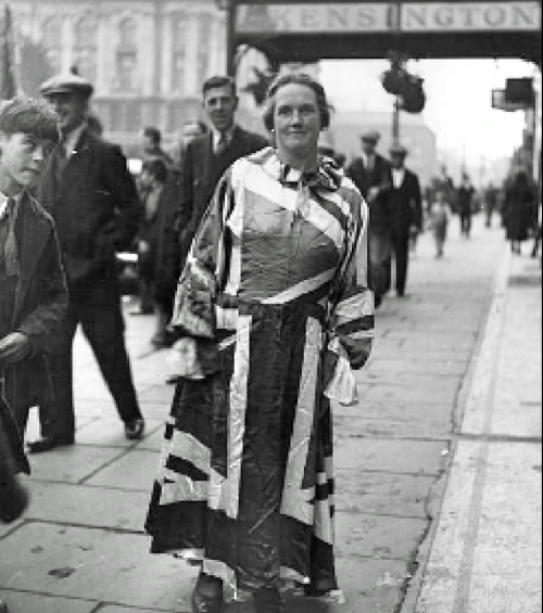 Woman dressed in Union flag dress outside the Kensington Hotel, College Square East, Belfast, 1930.