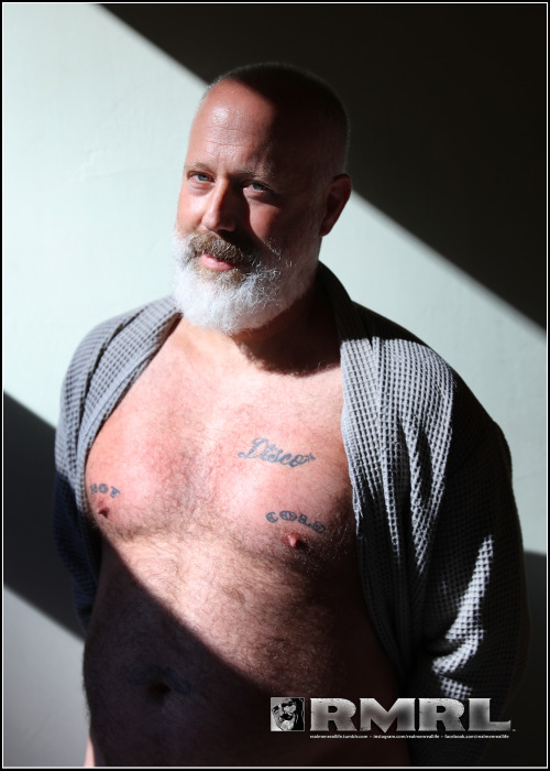 Handsome daddy bear Scott, in a robe, with intense California sunlight shining in on him. 