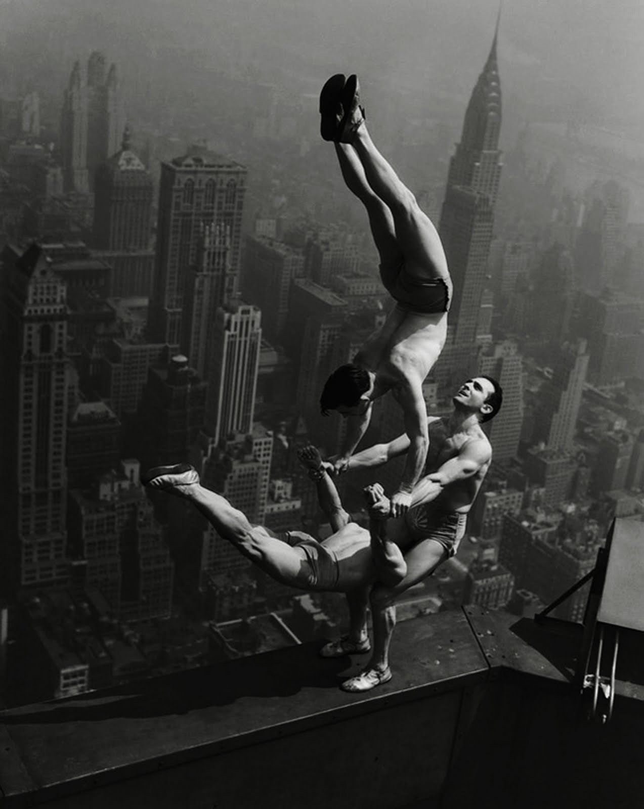 Acrobats Jarley Smith (top), Jewell Waddek (left), and Jimmy Kerrigan (right) perform