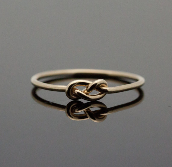 sixpenceee:  A “knot” ring. The ring symbolizes a knot that is not quite tied
