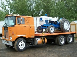 semitrckn:  1964 Coe Mack F715 classic flatbed with a Ford tractor on back