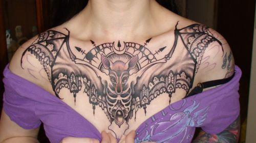 little-ms-spooky:  gothiccharmschool:   teal-cat: Behold the start of my beautiful chest piece by Teresa Sharpe. Not finished yet! Going back in July to get it colored. It’s a fruit bat with lace wings, moon phases above his head and crystal clusters