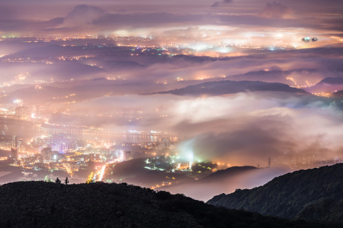 astoryforsupper:  nubbsgalore:  taipei glows under a blanket fog in these photos by wang wei zheng. (see also: dubai)  i want to print all of these on a ginormous blanket and wrap it around myself at all times because they’re so beautiful 