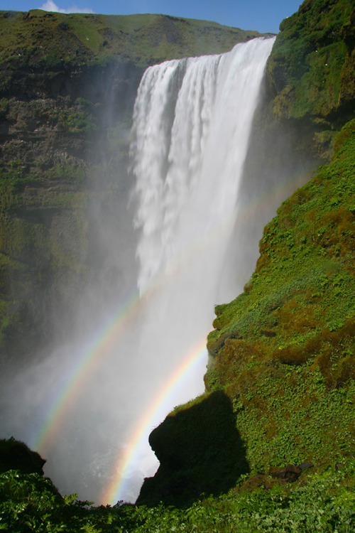 Catching the double rainbow at Skogafoss in Iceland.