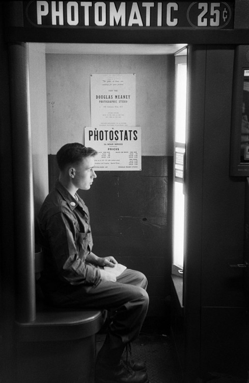 x1randevbprsiq29g4n:  Draftee in a photo booth, Camp Kilmer, 1952. By Harold Feinstein.