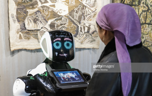 Visitors communicate with Mamed, a robot guide at the Naryn-Kala citadel, Derbent, Dagestan (2019).M