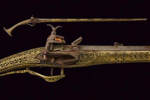 Brass mounted miquelet rifle from Albania, early 19th century.from Czerny’s International Auct