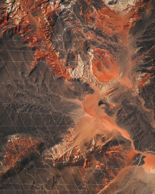 dailyoverview:Roads create a grid-like pattern on the landscape in a remote section of Argentina’s M