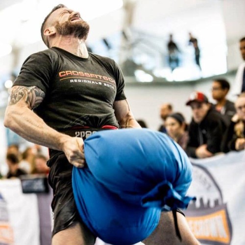 mrteenbear:  #tbt to the Winter Challenge. The pain was real! Thanks to @caraghcamera for the photo #crossfit #winterchallenge #sandbag #painface by @dr_m_stacks http://ift.tt/1GiX7xw