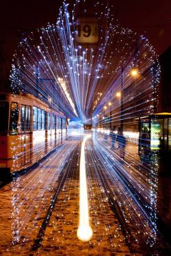 brucewombs:   did-you-kno:  sixpenceee:  Long exposure of a departing Tram in Budapest covered in 30,000 LED lights.   Source  Ghost train 