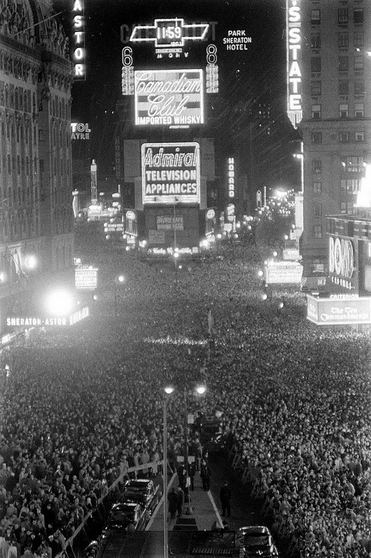 fuckyeahvintage-retro:  New Years party Times Square, 1956 © Walter Sanders 