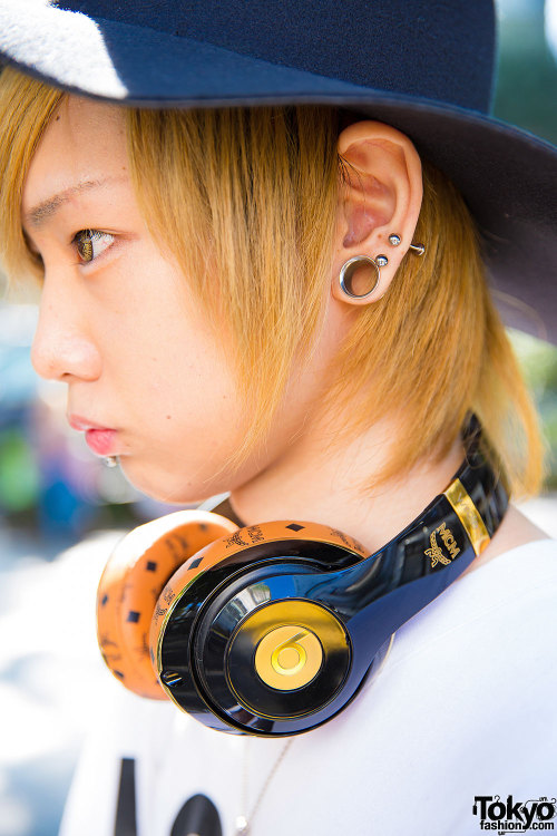 tokyo-fashion:  20-year-old Kenchu in Harajuku wearing a Hood By Air top with a bandana skirt, ripped jeans, studded boots, and clutch/headphones by MCM. Full Look