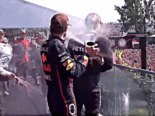 Max Spraying The Champagne On George 