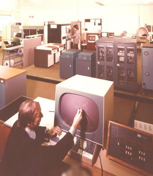 A user works at an IMLAC PDS-4. Rutherford Appleton Laboratory, Oxfordshire, Unites Kingdom.