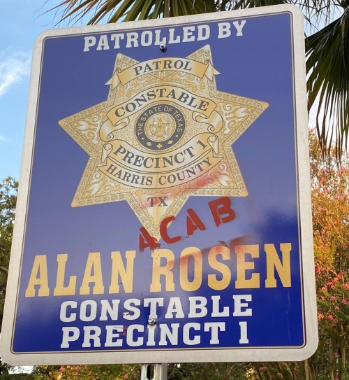 ACAB stencil on a cop sign in Montrose, Houston, TX