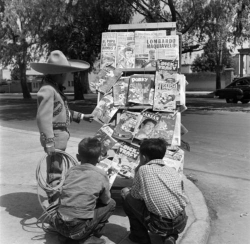 kvetchlandia:Earl Leaf     Young Boys Looking at Comic Books on a News Stand, Mexico City     1952