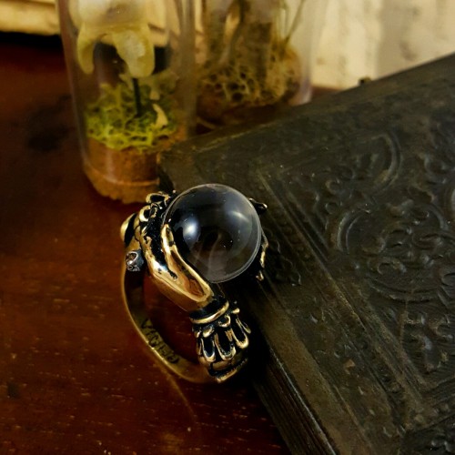 Oracle ring in antiqued brass with natural water clear quartz sphere. www.omniaoddities.com