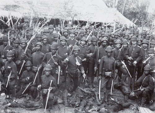 historicaltimes:Dutch and Indonesian colonial troops stand over the bodies of their enemies, date un