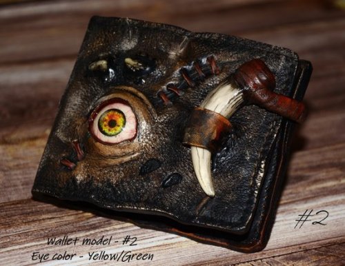 sixpenceee:A zombie eye, steampunk leather wallet. The wallet is handmade in a vintage style with genuine leather, with realistic, distressed detailing and durable material