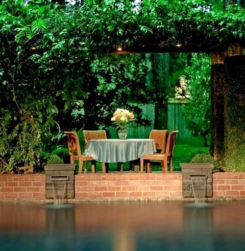 Natural Pool In HoustonExample Of A Mid-sized Classic Backyard Brick And Custom-shaped Natural Pool Fountain