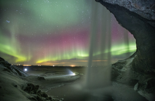 photos-worth:  The path behind the lights, by villiolafs  Finally the weather cleared up when I had the time to go to Seljalandsfoss one of my favourite waterfalls in Iceland 