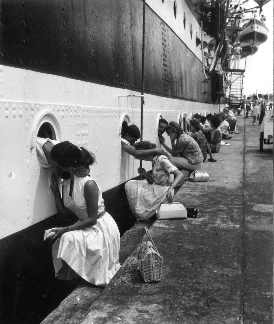 historicaltimes:  Sailors say goodbye to their girls, taken at the departure of the