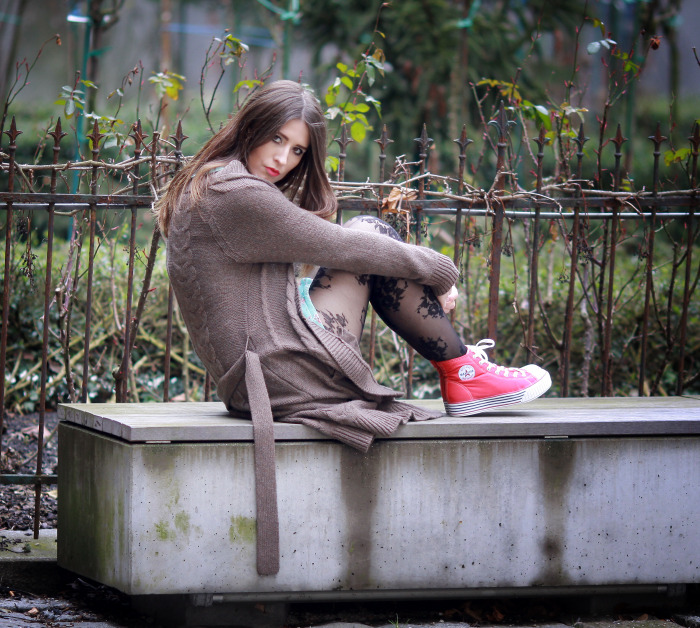 pantyhoseparty:  Monika in floral print tights, light brown wool coat and bright