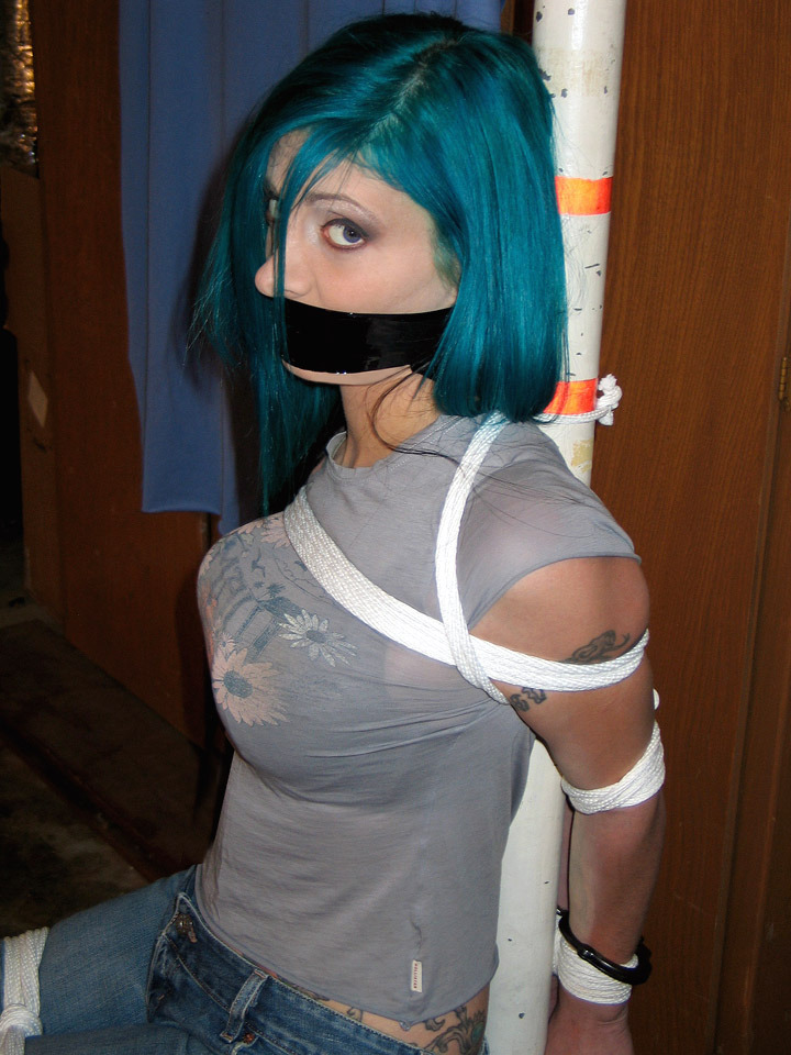 gaghermouth:  Sitting pole tie and gagged, dont she look sweet with that cleavage?