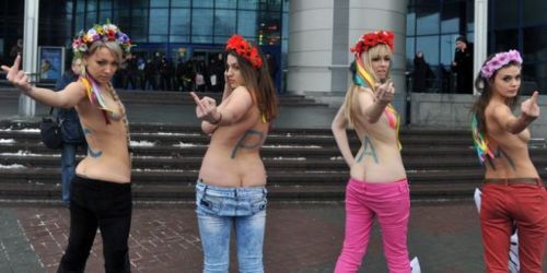  Femen, a Ukrainian feminist organization, with their pants down during a nude protest against women’s sexual exploitation. Inna Shevchenko (black pants), Alexandra Shevchenko (pink pants) and Oksana Shachko (red pants) are three of the co-founders